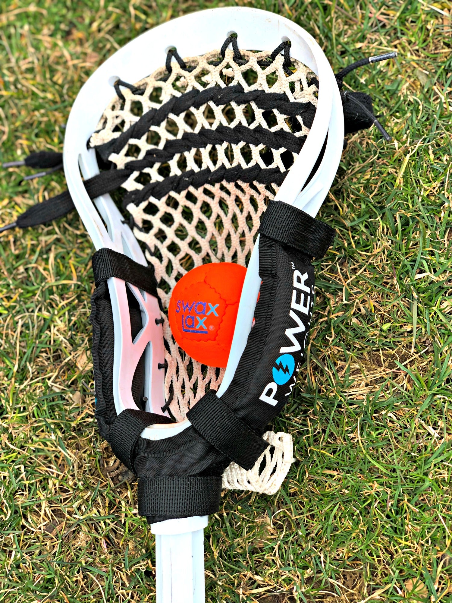 Swax Lax Power Weights on boy's lacrosse stick